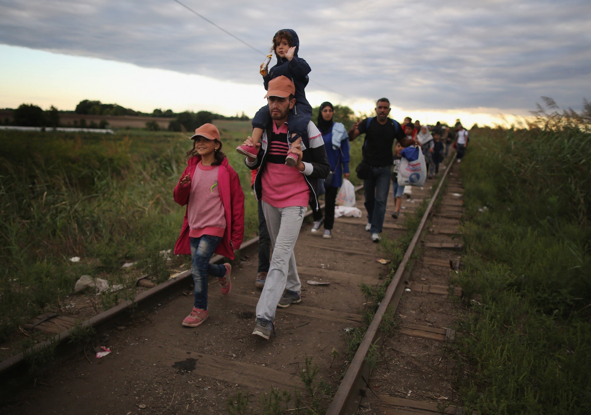 Refugees cross the border from Serbia into Szeged, Hungary.