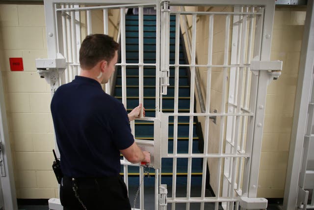 A door is closed by a prison guard at the Cookham Wood Young Offenders Institution