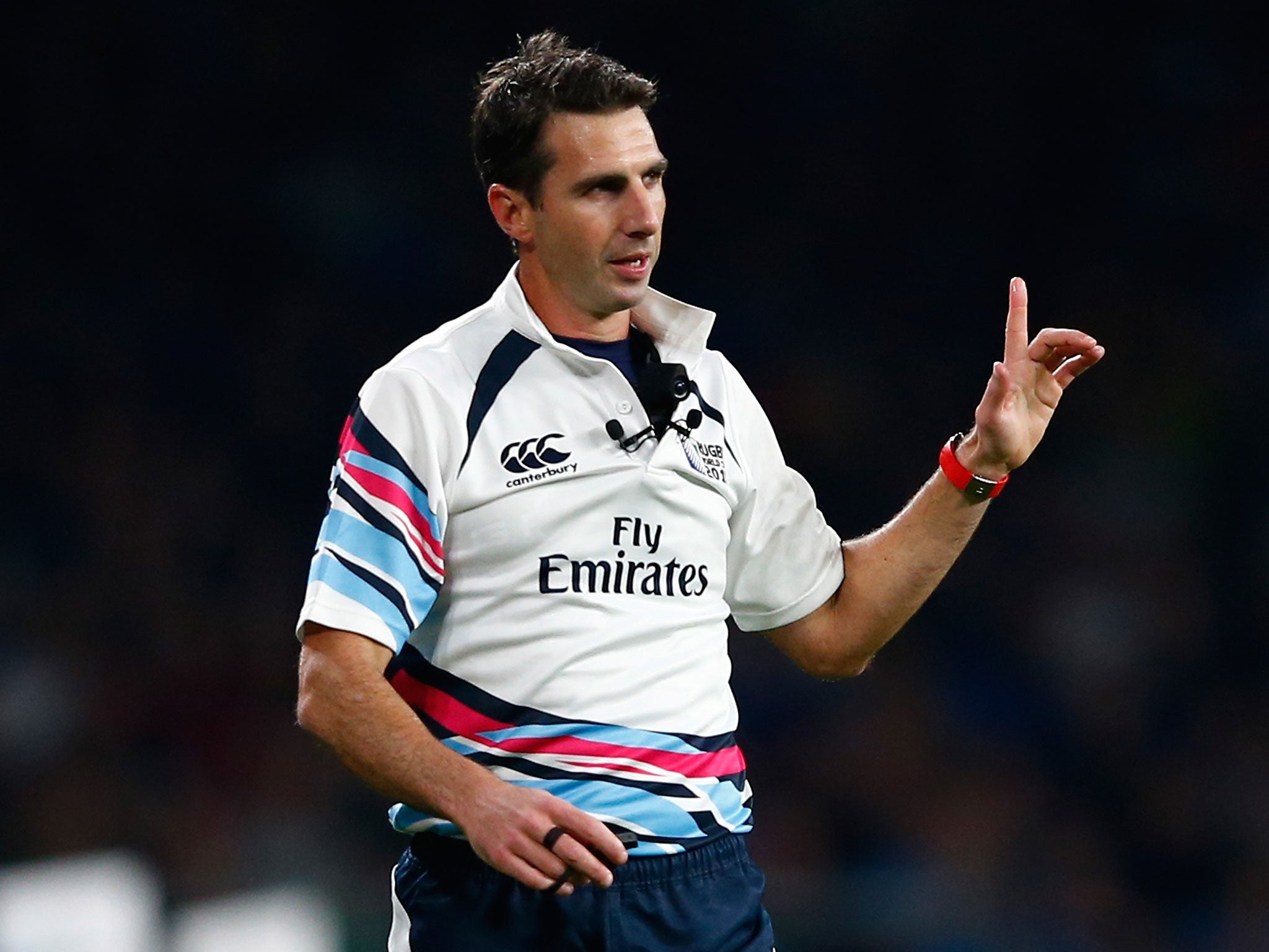 Referee Craig Joubert refers a decision to the TMO during the 2015 Rugby World Cup Pool D match between France and Italy