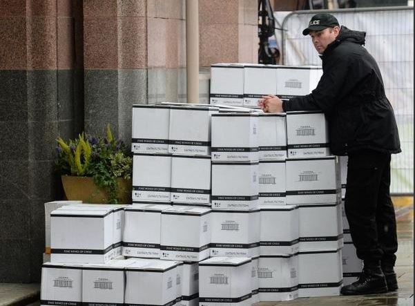 Police help deliver crates of champagne to the Midland Hotel, the venue for this autumn's Tory party conference in Manchester