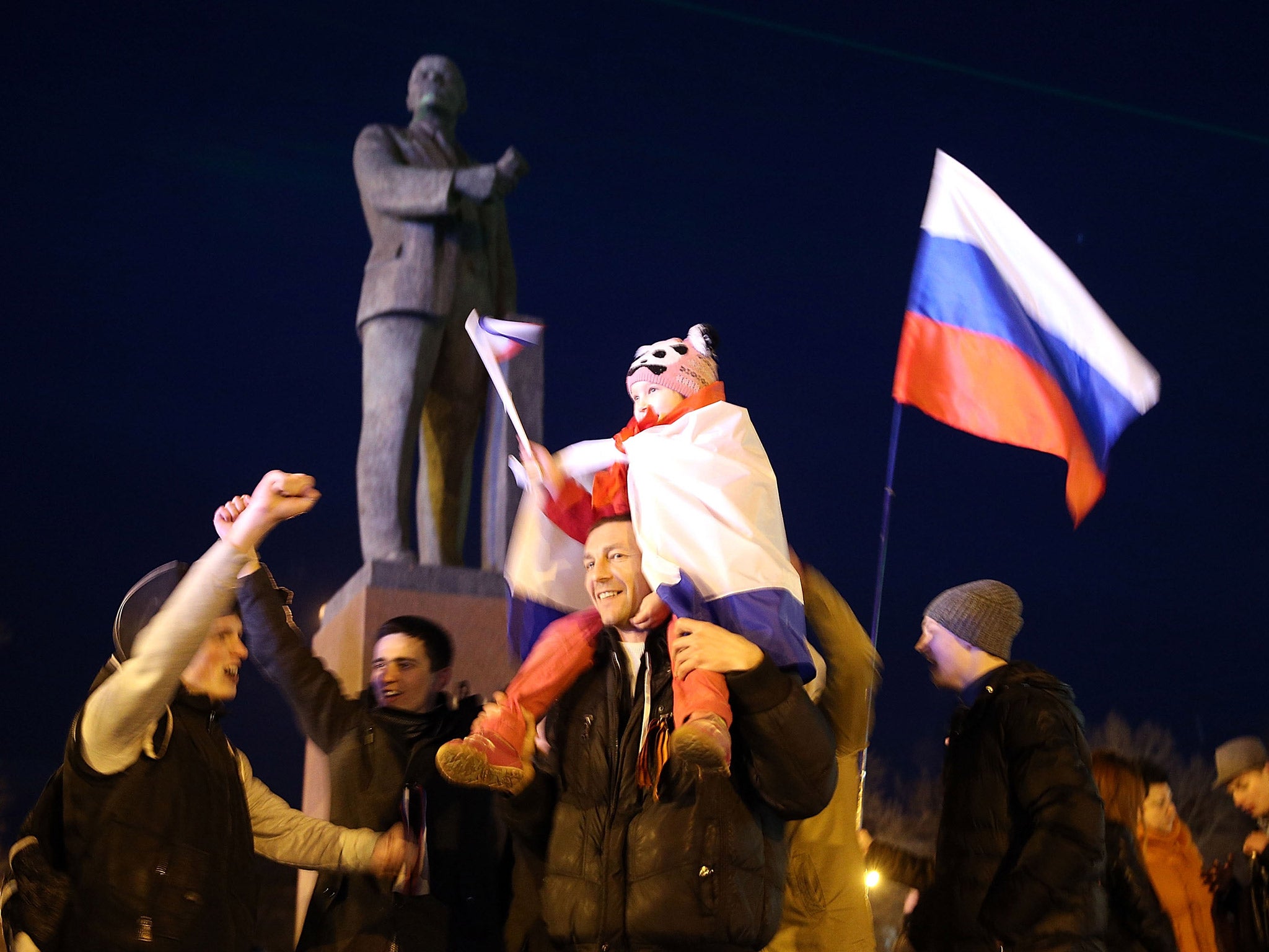 Crimeans celebrate in Lenin Square after going to the polls in March (Getty)