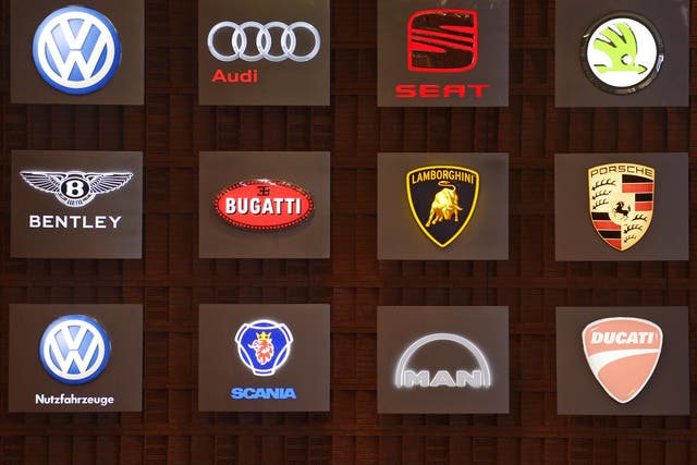 A board showing the logos of car brands belonging to Volkswagen