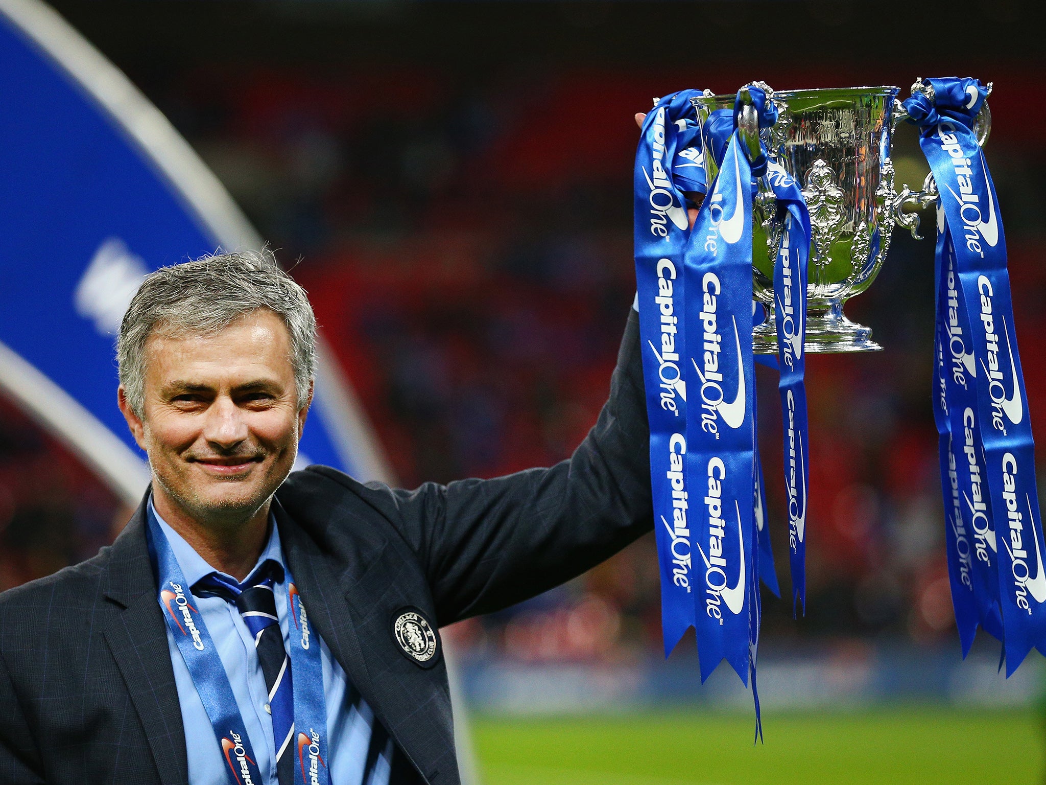 Jose Mourinho lifts the League Cup trophy last season