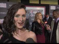 Anne Hathaway spots Mariah Carey and loses it