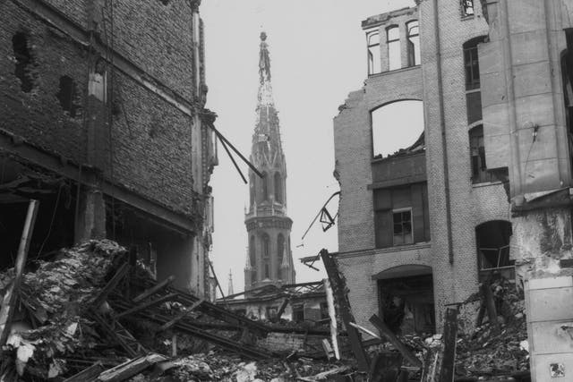 Lack of remorse: St Peter’s Church can be seen through the ruins of the Spittlemarkt Strasse area of defeated Berlin