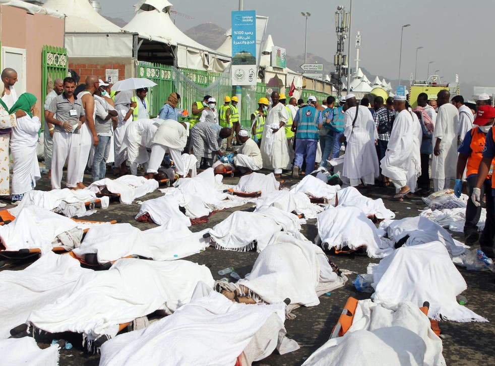 Muslim pilgrims and rescuers gather around people who were crushed by overcrowding in Mina, Saudi Arabia during the annual hajj pilgrimage 