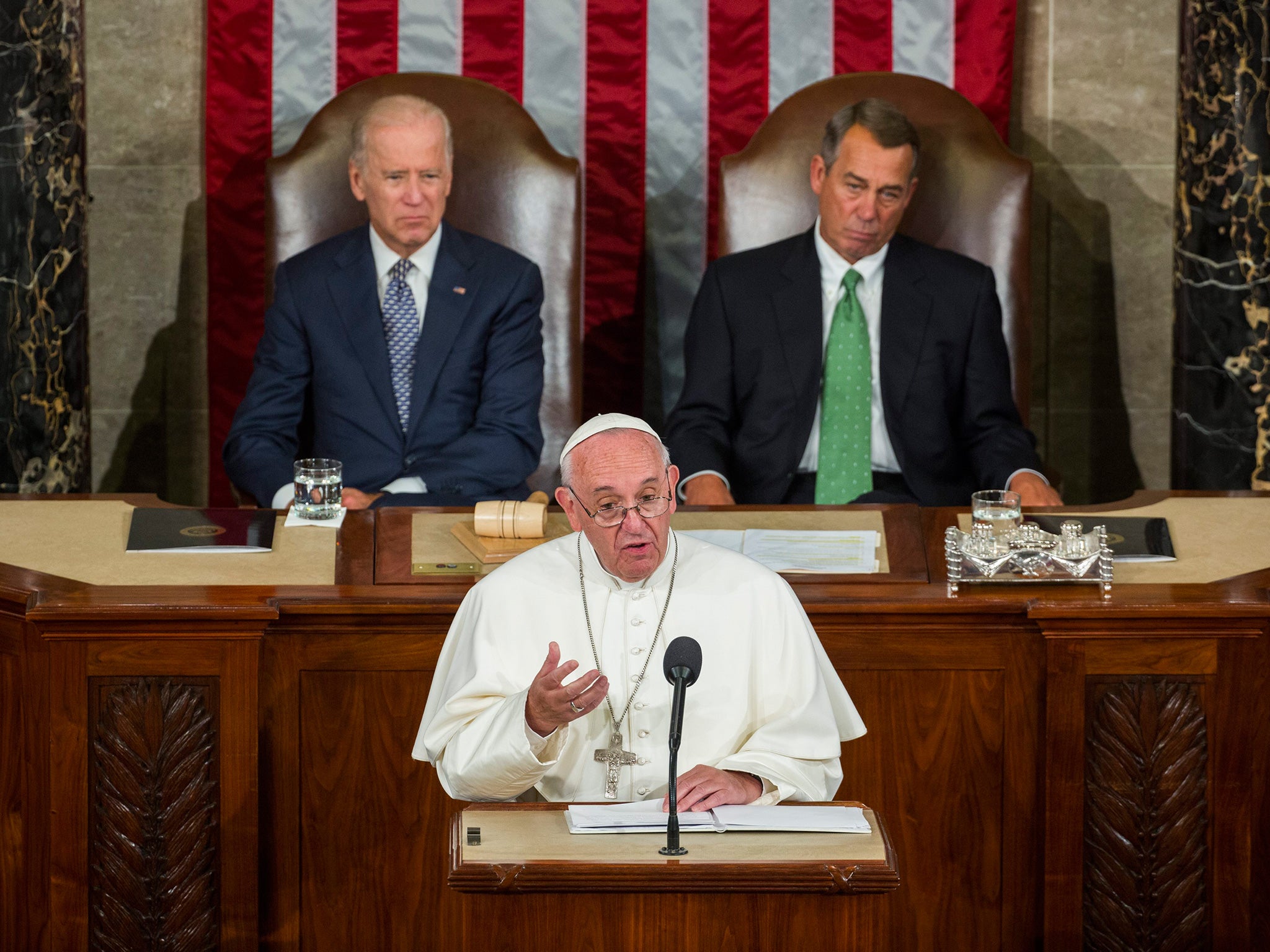 Pope Francis (c) delivers a speech between US Vice President Joe Biden and Speaker of the House John Boehner