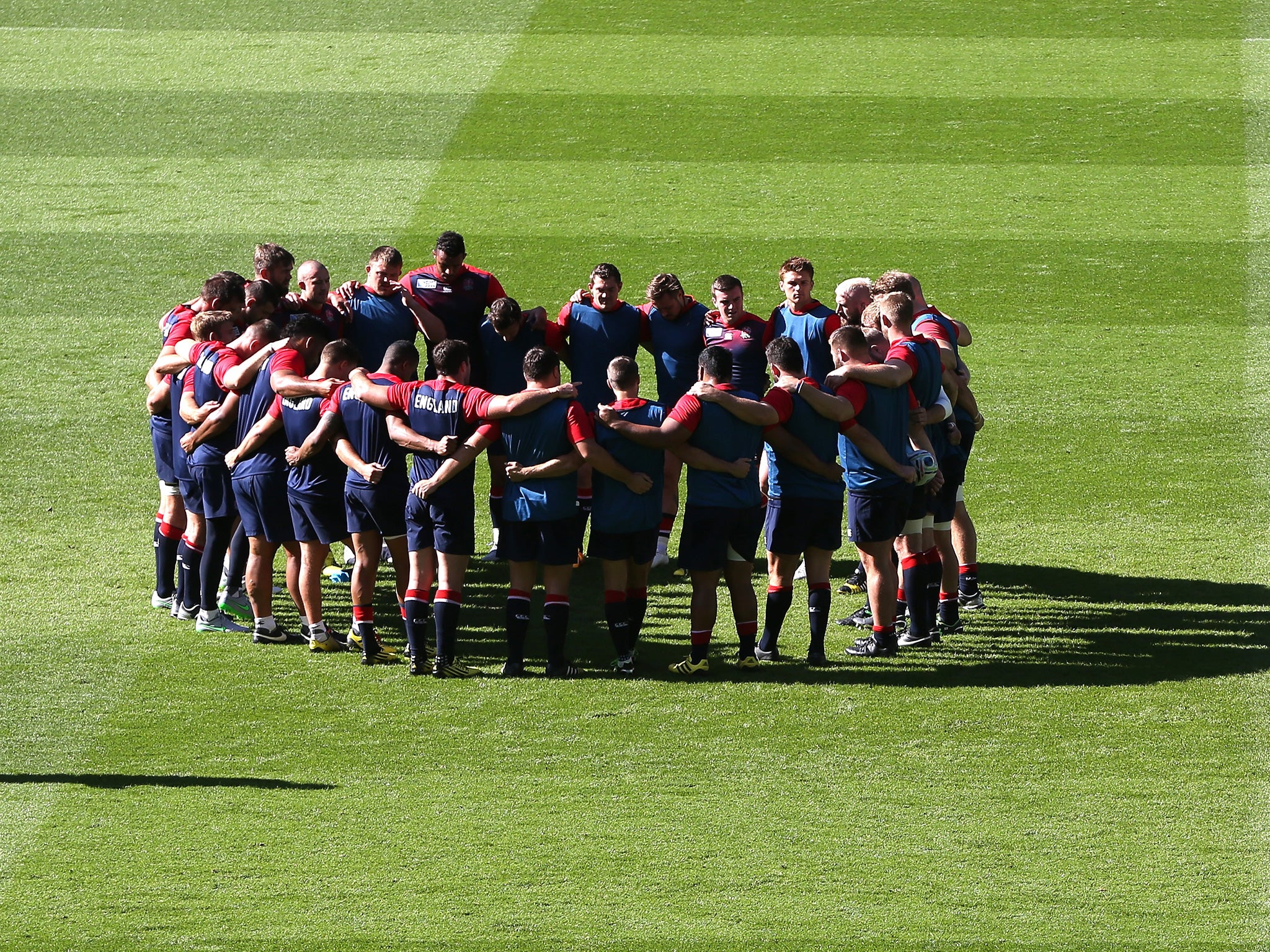 The players’ huddle during the England captain’s run at Twickenham yesterday