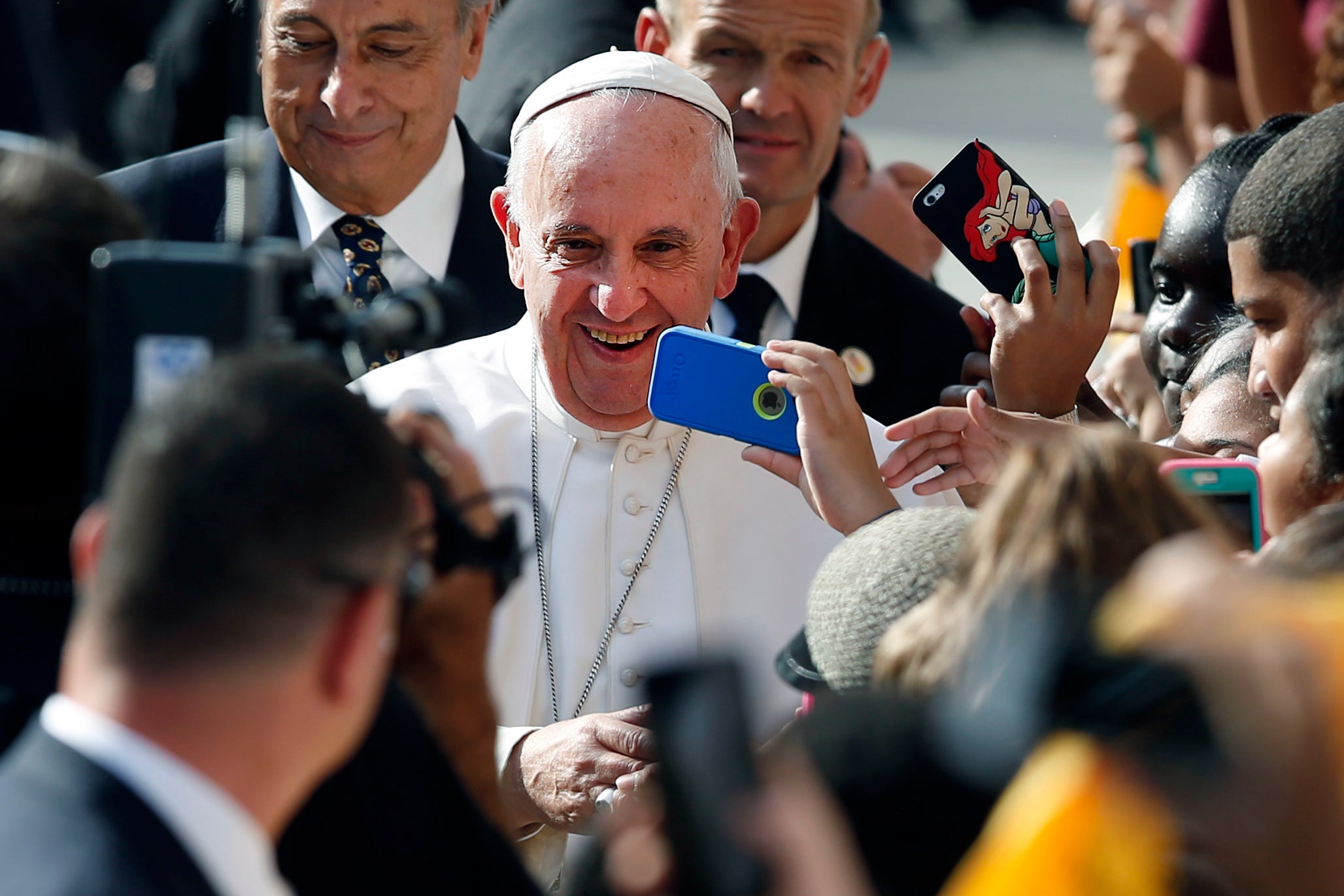 Pope Francis greets a crowd in East Harlem.