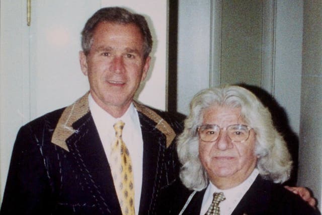 De Paris with George W Bush, who ‘proudly wore his suits,’ according to his spokesman