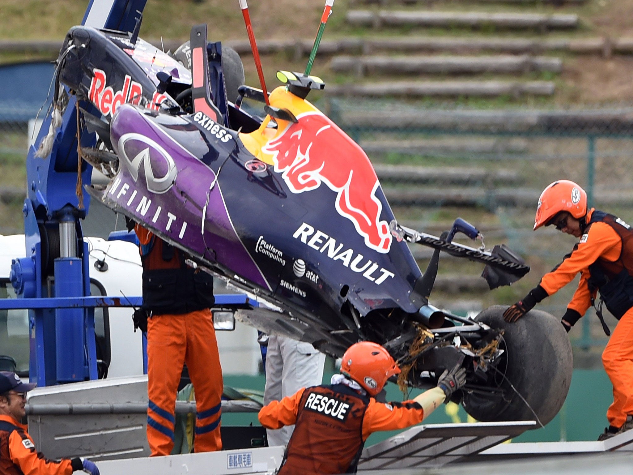 Daniil Kvyat's Red Bull is retrieved after a heavy accident