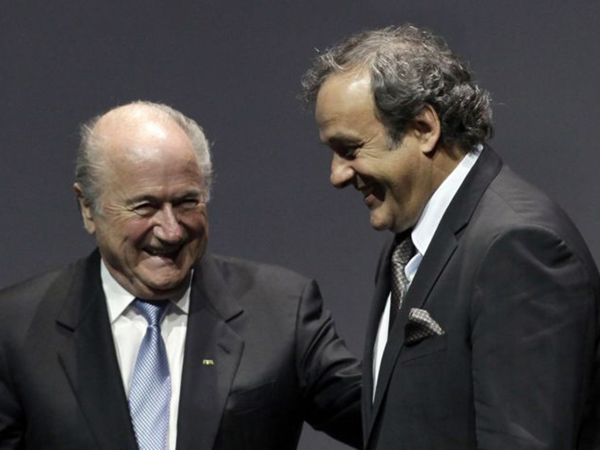 Fifa’s Sepp Blatter and Michel Platini share a joke back in 2012