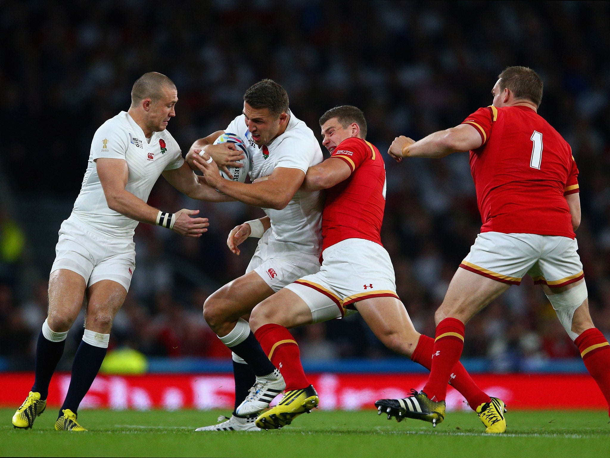 Sam Burgess is tackled by Scott Williams as Mike Brown and Gethin Jenkins look on