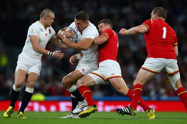 Sam Burgess is tackled by Scott Williams as Mike Brown and Gethin Jenkins look on