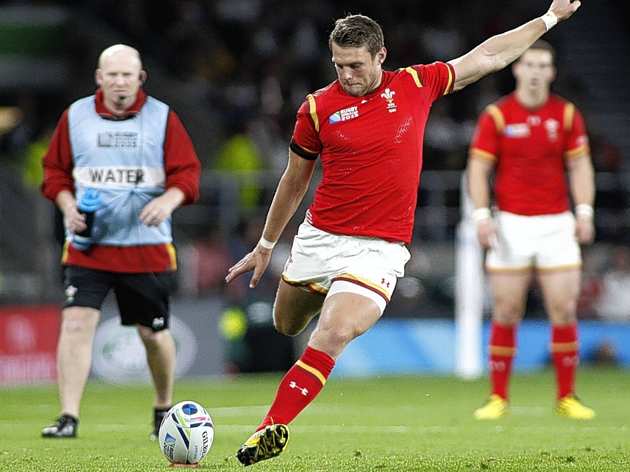 Dan BIggar kicks a penalty for Wales after yet another error by England