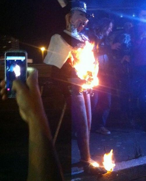 An effigy of the so-called "hipster cop" was burnt at the protest against gentrification