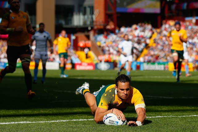 Australia centre Matt Toomua crosses for a try during the 2015 Rugby World Cup Pool A match between Australia and Uruguay at Villa Park