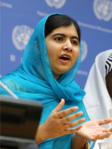 Malala Yousafzai shows off her magic trick to Stephen Colbert