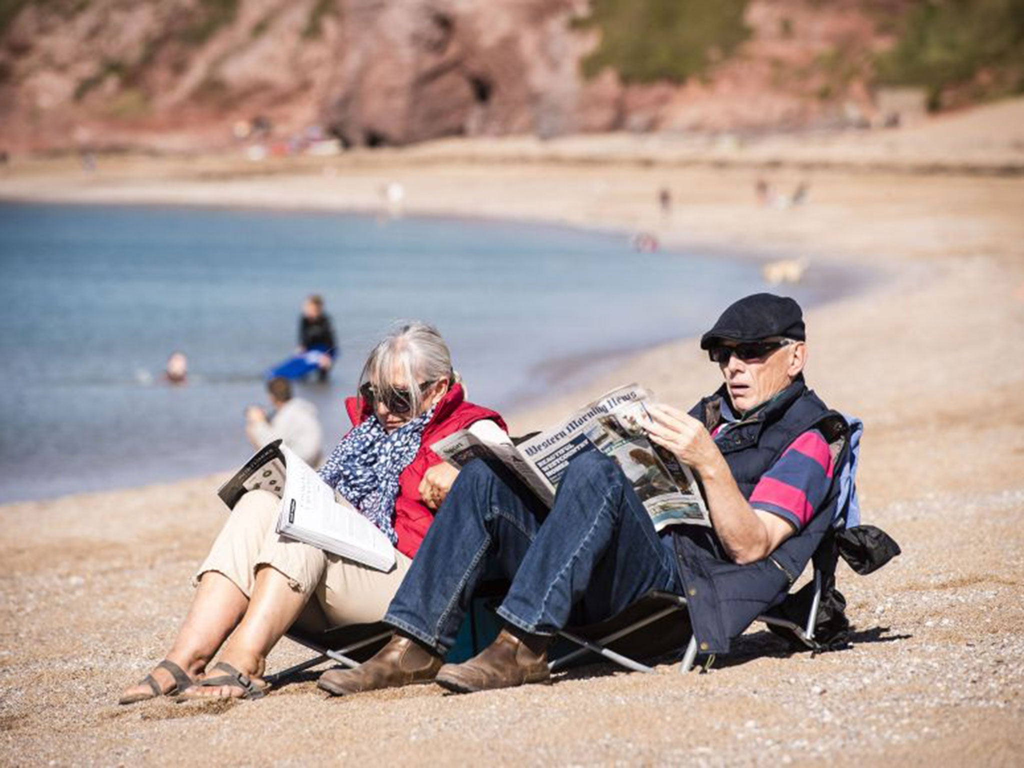 &#13;
Another couple enjoy the fine weather on Thurlestone Beach, Devon, on Saturday&#13;