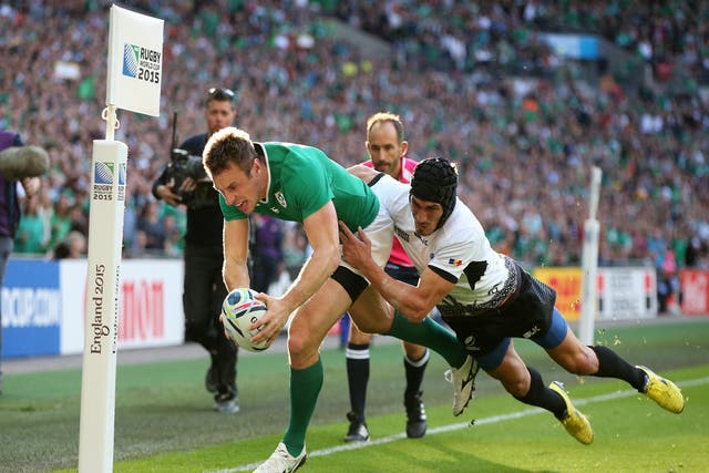 Ireland's Tommy Bowe scores the first of two tires against Romania