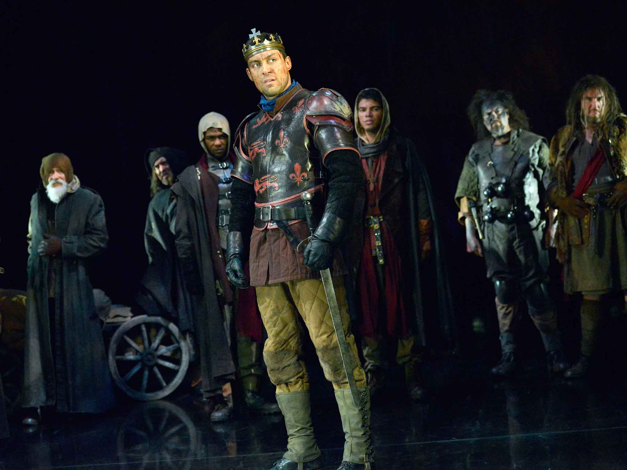 Alex Hassell (Henry V) with company