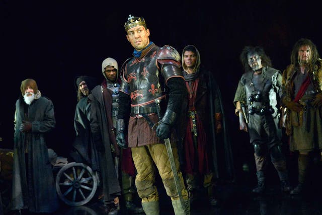 Alex Hassell (Henry V) with company