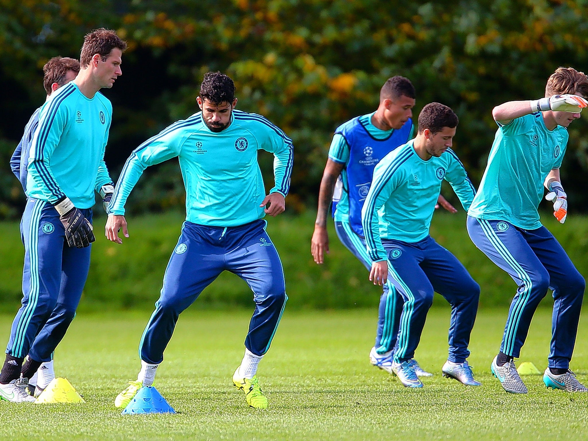 Diego Costa (second left) trains with the Chelsea squad at Cobham yesterday