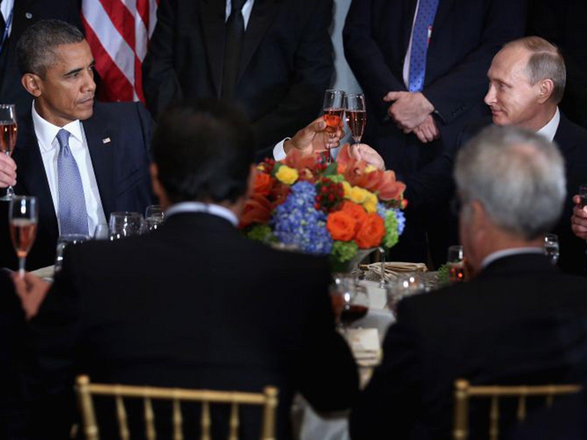 Barack Obama and Vladimir Putin toast during a luncheon hosted by UN Secretary-General Ban Ki-moon during the 70th annual UN General Assembly