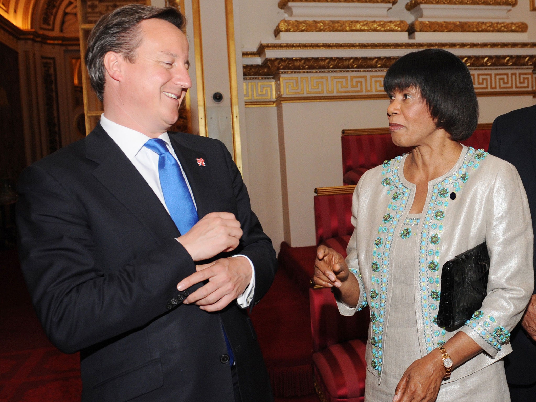 David Cameron (L) meets with Prime Minister of Jamaica Portia Simpson Miller at Buckingham Palace in 2012