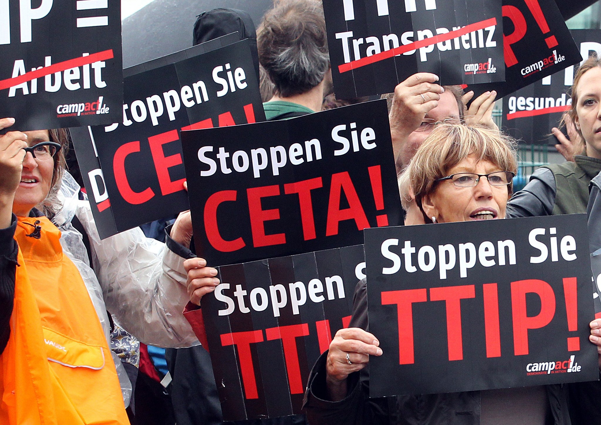 Protestors take part in a demonstration against TTIP and CETA in front of the party headquarters of the Social Democrate Party in Berlin on September 20, 2014