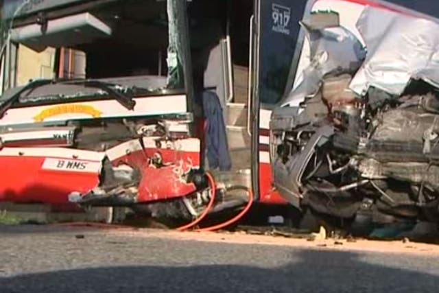 An image showing the damage to the school's bus and the car that crashed into it in Normandy