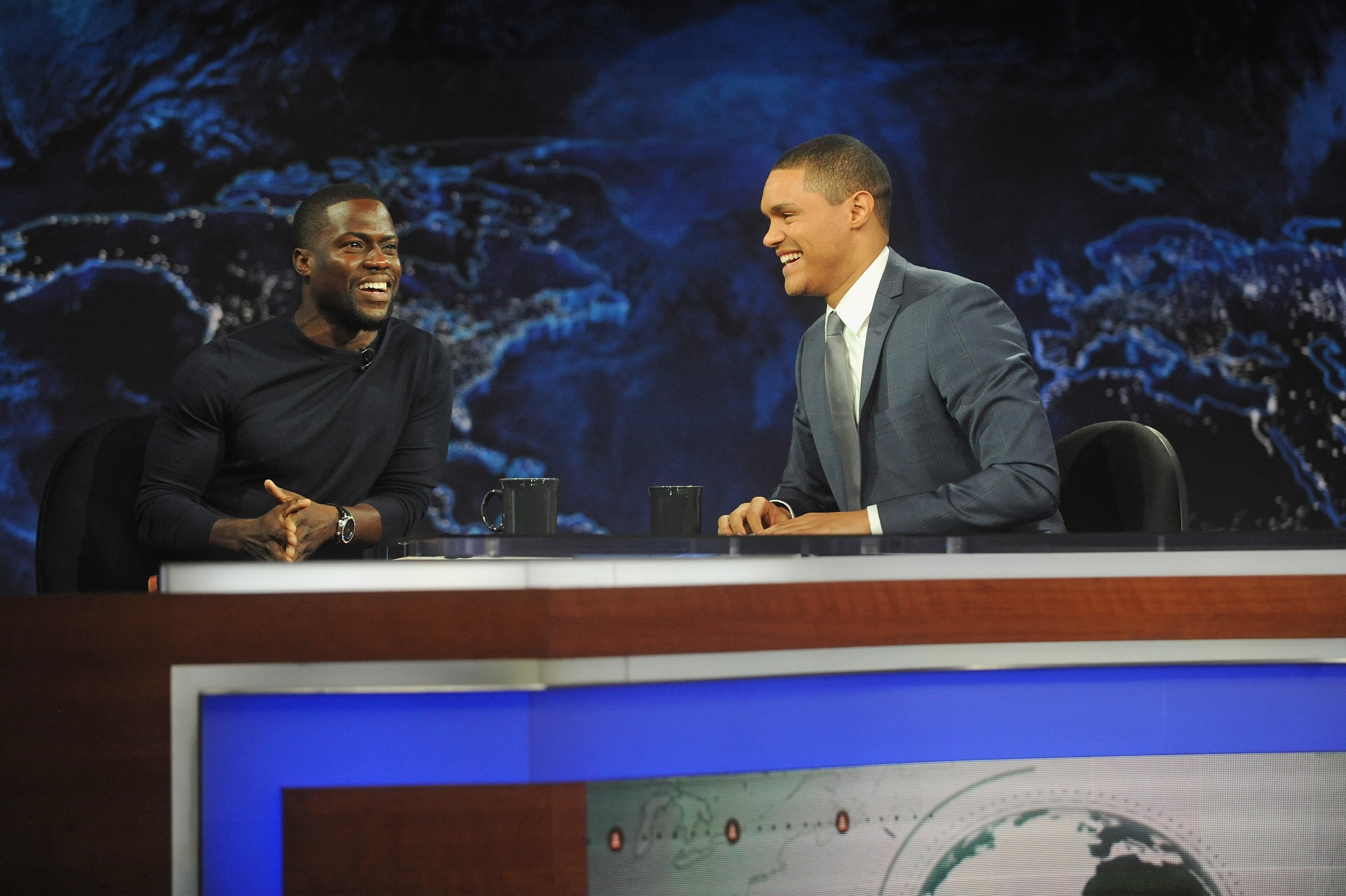 Trevor Noah interviews his first guest Kevin Hart. Brad Barket