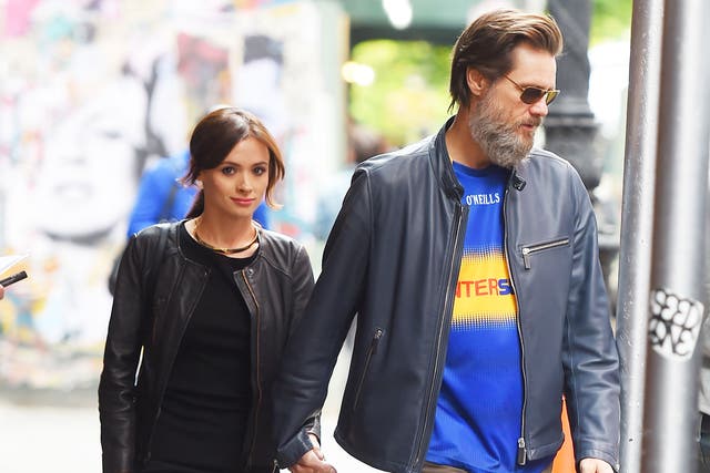 Jim Carrey and his girlfriend, Cathriona White, hold hands while taking a walk in Manhattan