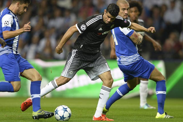 Diego Costa jostles for the ball with Ruben Neves and Maicon