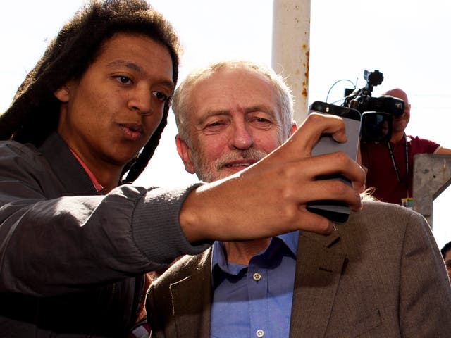 Jeremy Corbyn poses for a selfie with a supporter in Brighton