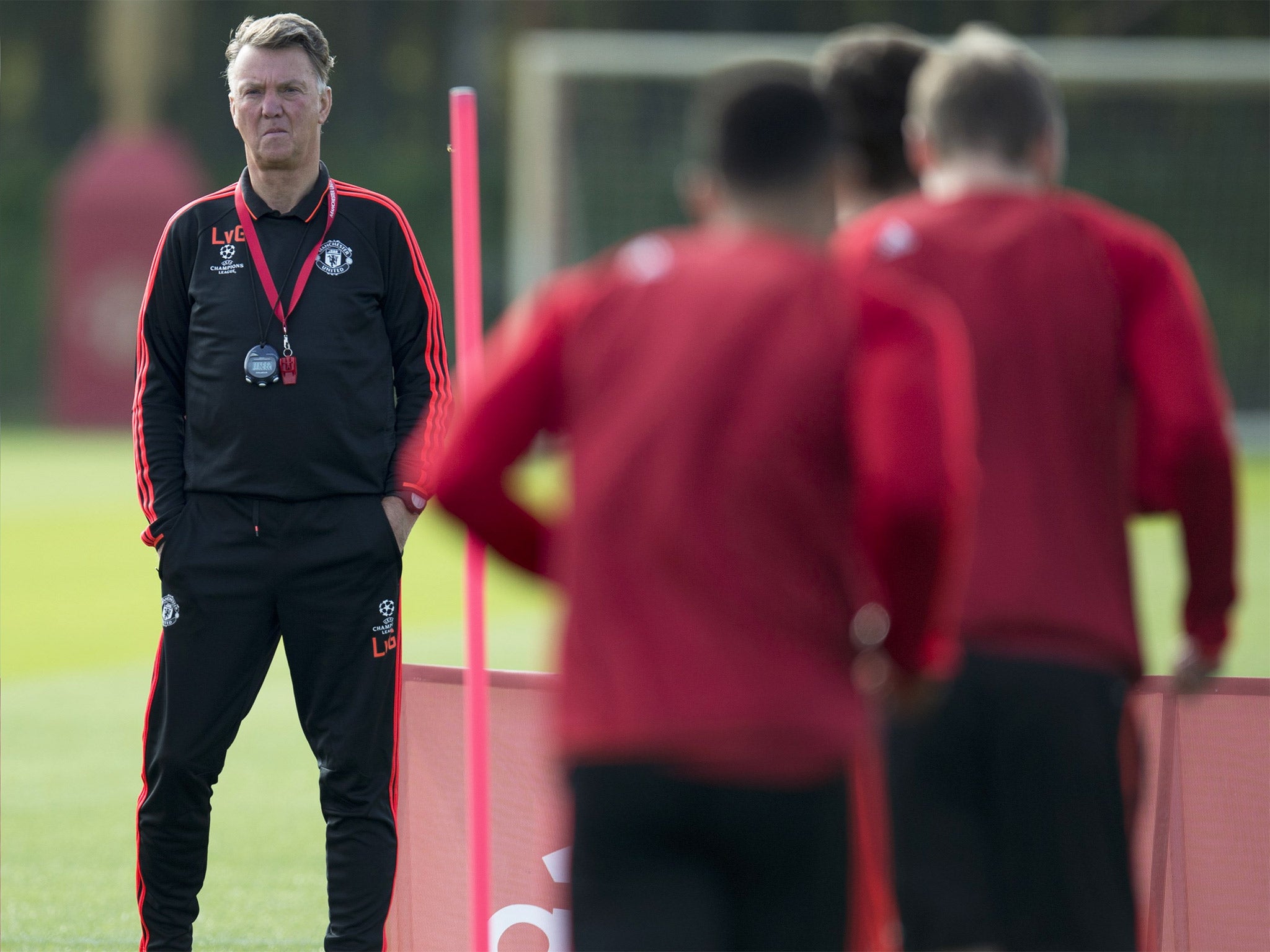 The Manchester United manager looks on during training