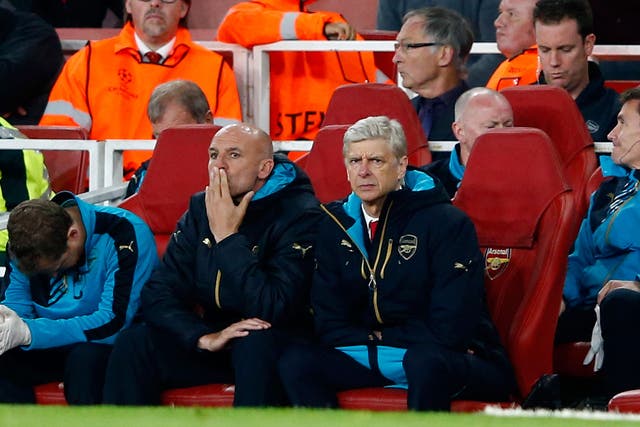 Arsene Wenger looks on from the dugout