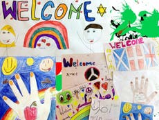 Posters welcome refugee children as they enter UK 