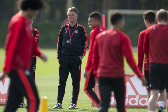 Louis van Gaal watches Manchester United players train