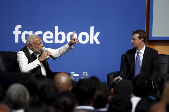 Indian Prime Minister Narendra Modi (L) and Facebook CEO Mark Zuckerberg have a conversation on stage during a town hall at Facebook's headquarters in Menlo Park, California September 27