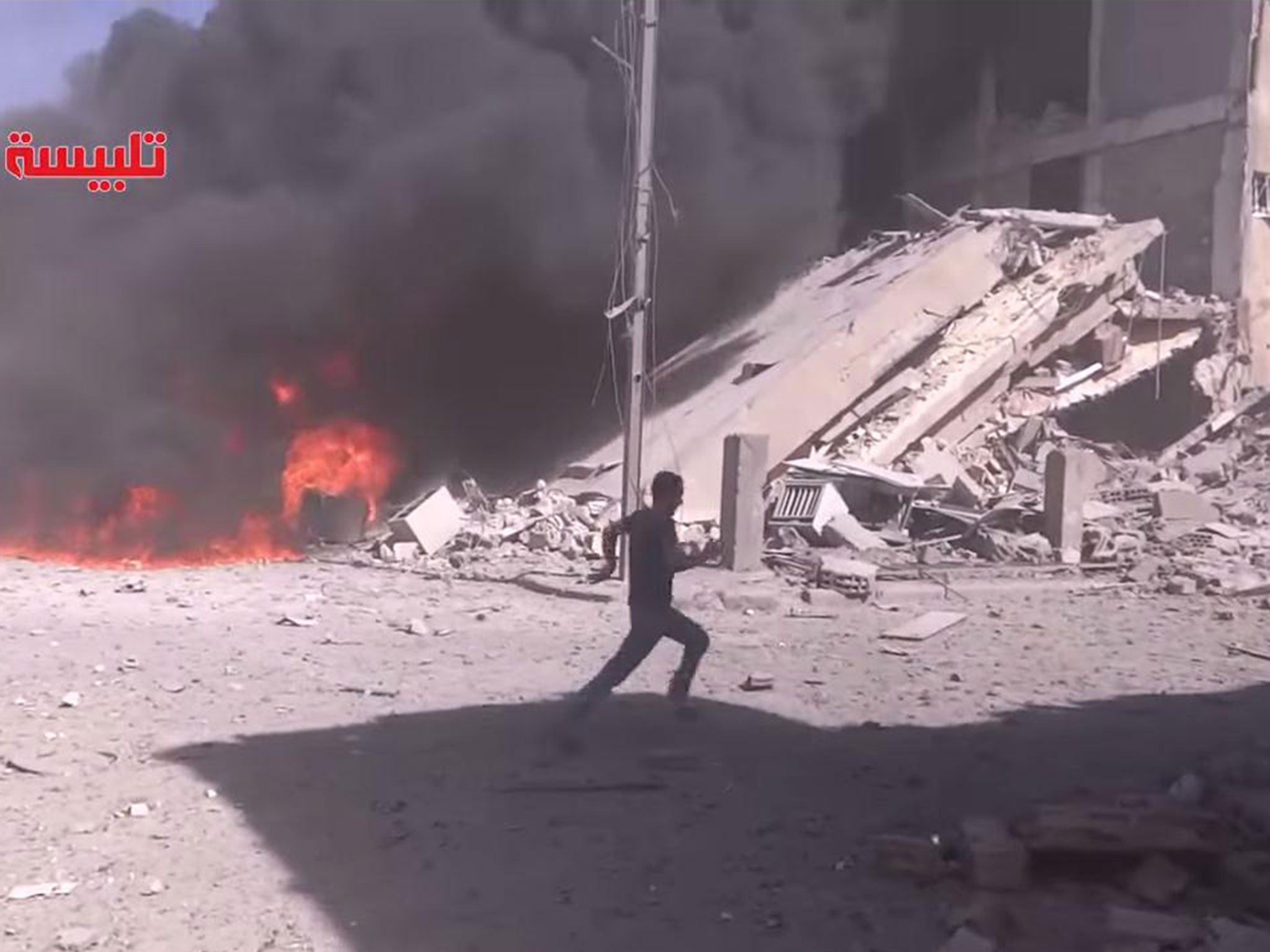 A screengrab of footage claiming to show the aftermath of air strikes by a Russian plane in Tabliseh, Syria, on 30 September 2015