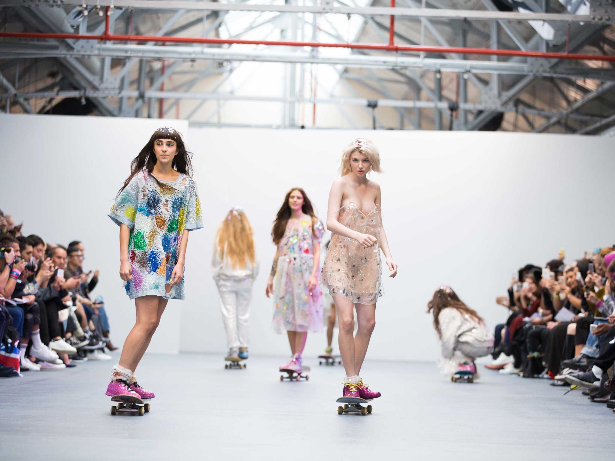 Models skate down the runway at London Fashion Week
