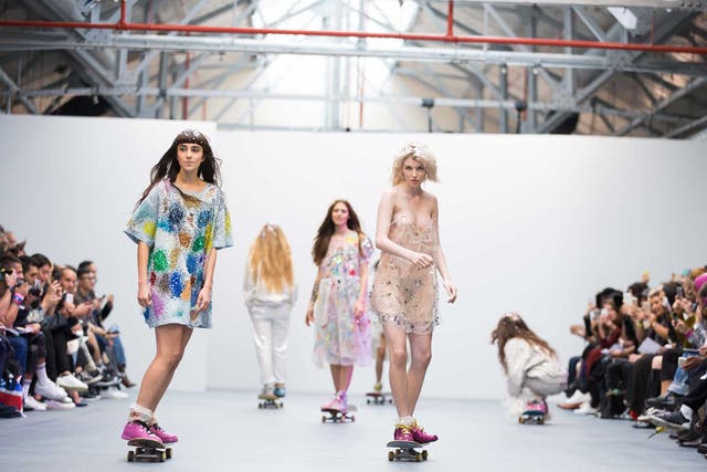 Models skate down the runway at London Fashion Week