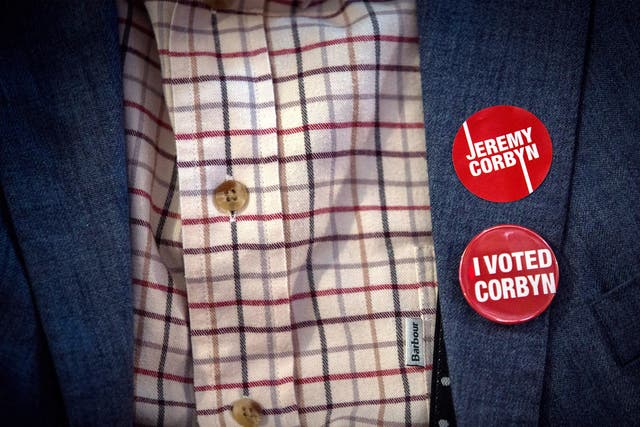 A supporter of Jeremy Corbyn, MP for Islington North and candidate in the Labour Party leadership election, wears badges on a jacket during speaches at the Rock Tower on September 10, 2015
