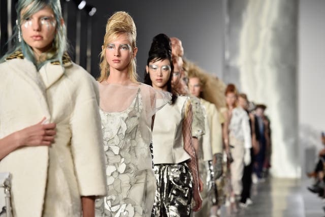 PARIS, FRANCE - SEPTEMBER 30: Models walk the runway during the Maison Margiela show as part of the Paris Fashion Week Womenswear Spring/Summer 2016 on September 30, 2015 in Paris, France.