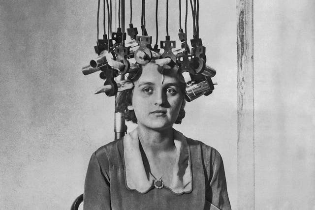 A model having her hair permed at the Hairdressing Fair in London, 1928
