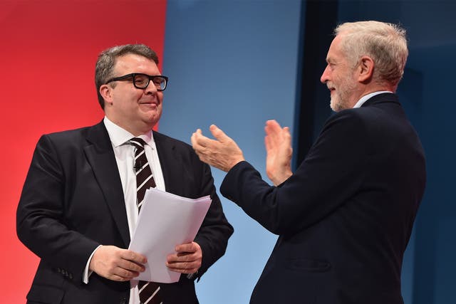 Deputy Leader of the Labour party Tom Watson recieves applause from Jeremy Corbyn following his closing speech
