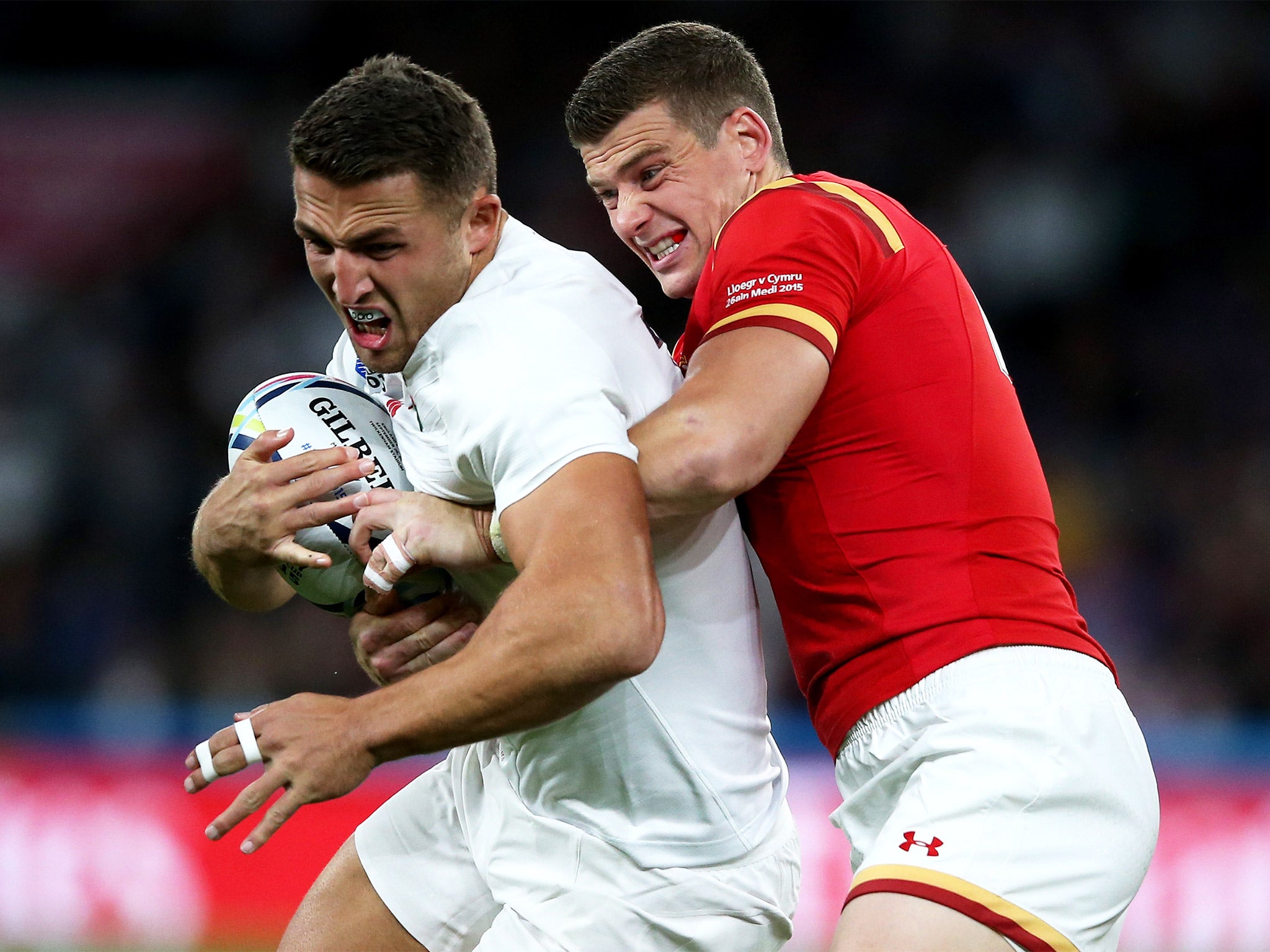 Sam Burgess is tackled by Scott Williams of Wales