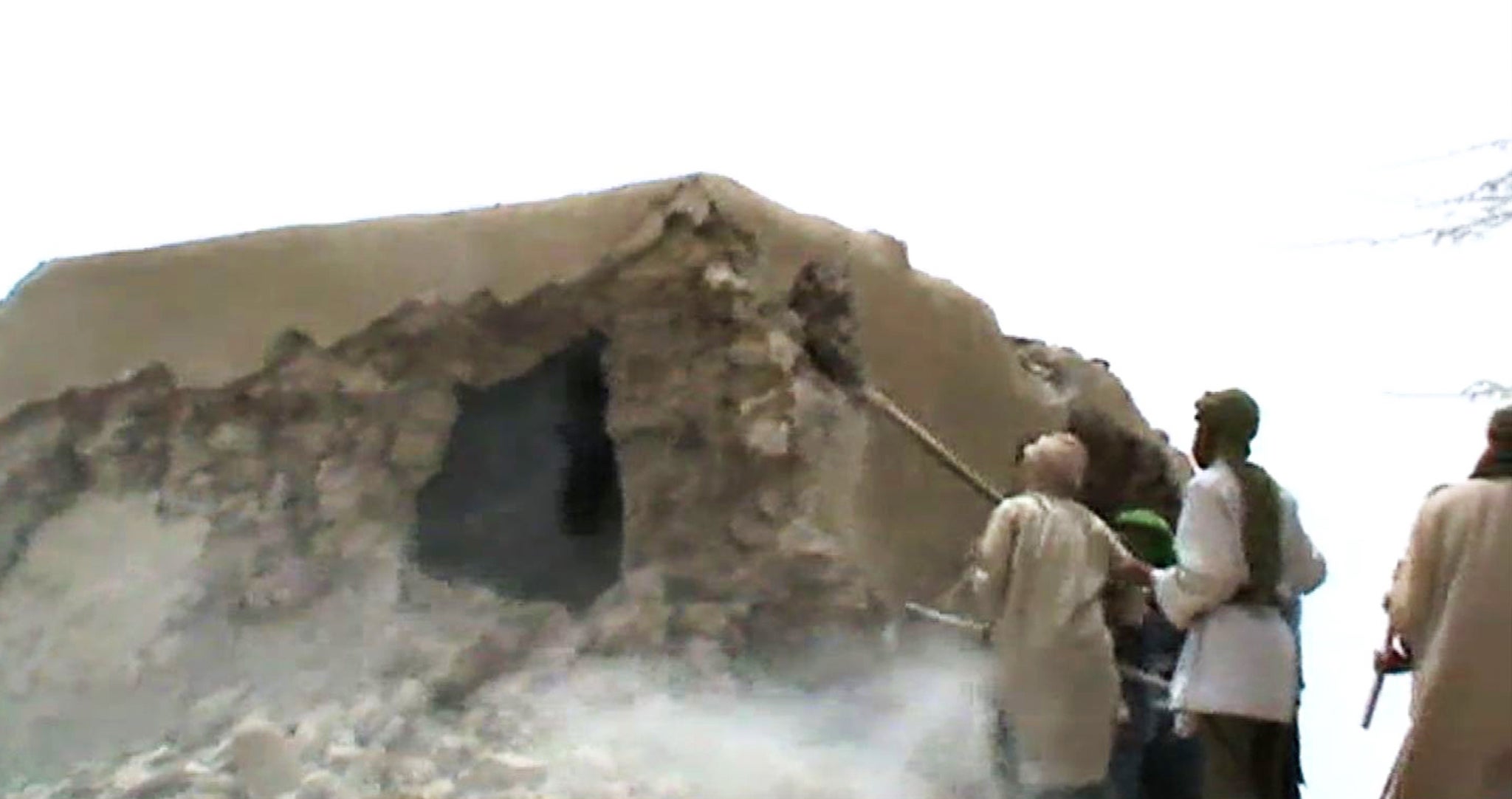 Islamist militants destroying an ancient shrine in Timbuktu on July 1, 2012