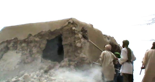 Islamist militants destroying an ancient shrine in Timbuktu on July 1, 2012